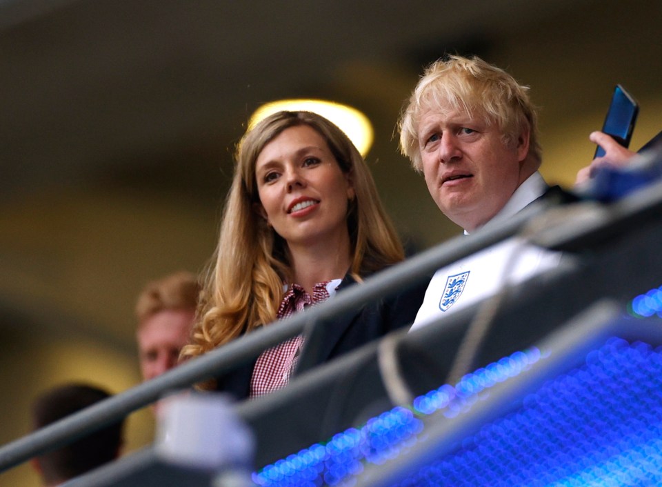 Boris Johnson and Carrie clapped on from the stands