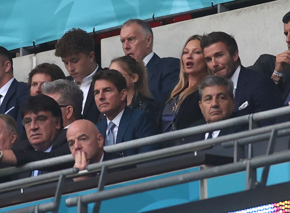 Tom Cruise - who was at the Wimbledon final earlier - sitting next to David Beckham