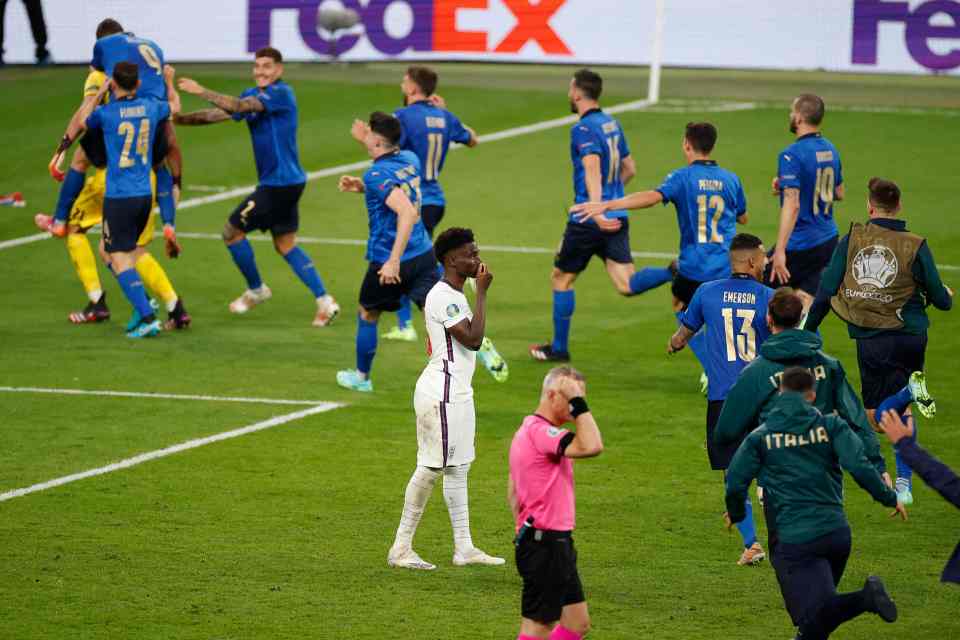 Italy players mobbed Donnarumma after his save won them the Euro 2020 crown