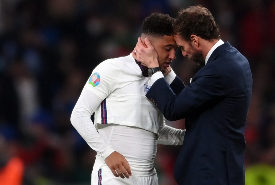 Southgate also rushed to Sancho to put his arm around him as the youngster missed his spot-kick