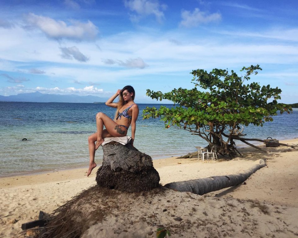 AJ made sure to get a good snap on a beach in the Philippines