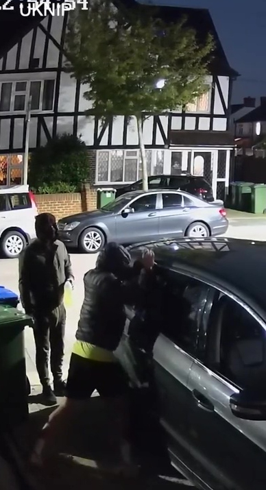 Two thugs are seen forcing open the Smithy family car before setting fire to it