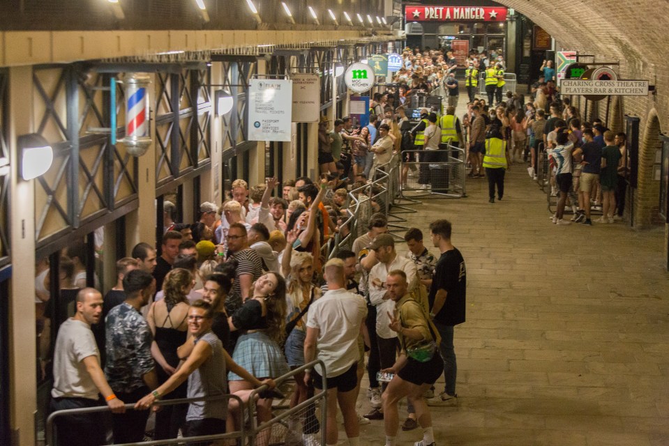 Partygoers wait in a long queue to 'Heaven' in central London