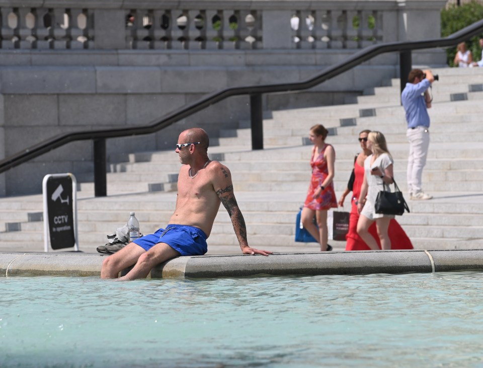 A man cooling down in Trafalgar Square