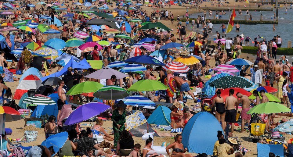 Beachgoers enjoy another day of red hot sunshine at Bournemouth in Dorset