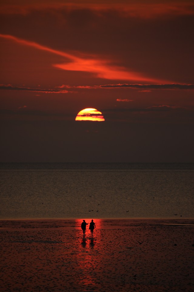 People out for a walk on at Heacham, Norfolk