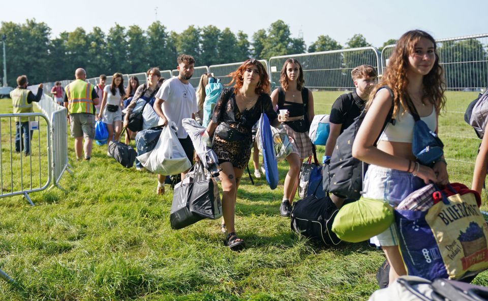 Festival-goers queue without social distancing and masks