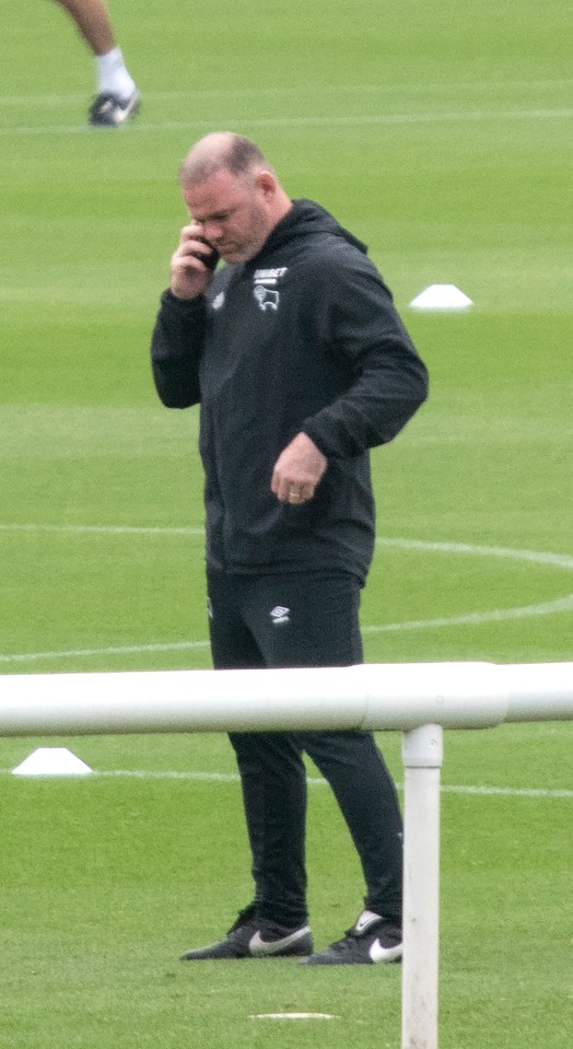 Rooney, pictured at Derby County training yesterday, believes he was 'set up'