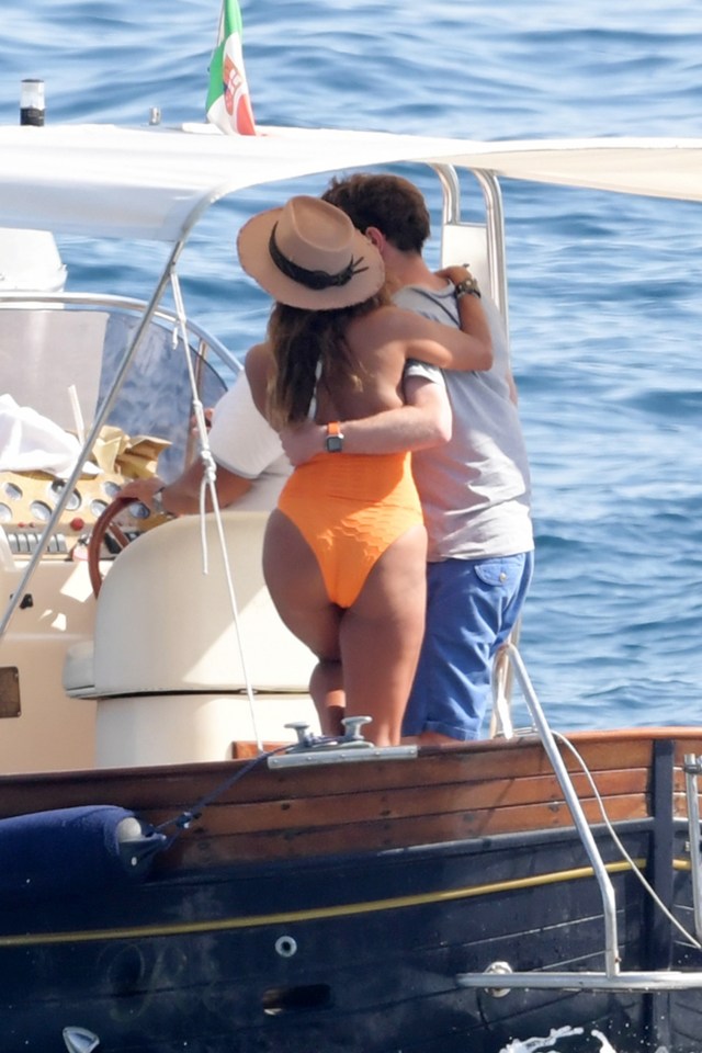 Jack posed on board with one of them, who was wearing a skimpy orange swimsuit