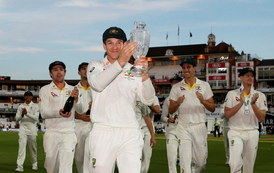 Tim Paine and his Australia team-mates celebrate retaining the Ashes with the crystal trophy in 2019