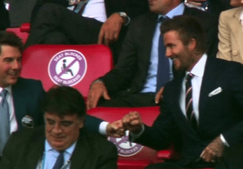 Tom Cruise and David Beckham are caught on camera with their touching moment to celebrate England’s early opener