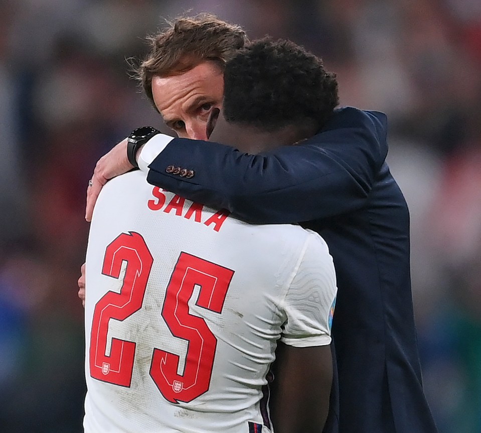 Saka was consoled by Southgate after his penalty was saved in the shootout