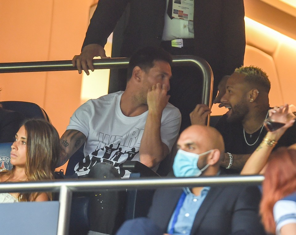 Neymar watches last night's game alongside Leo Messi