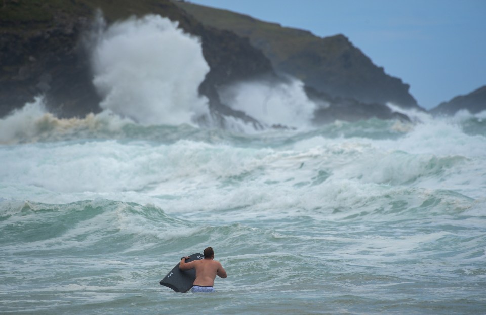 Bodyboarders brave the waves in rough seas at Fistral beach