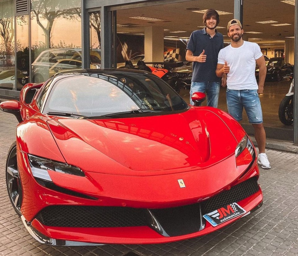 Aguero poses with his new electric Ferrari worth £426,000