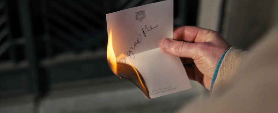 James is seen burning a note in a cemetery which says 'forgive me'