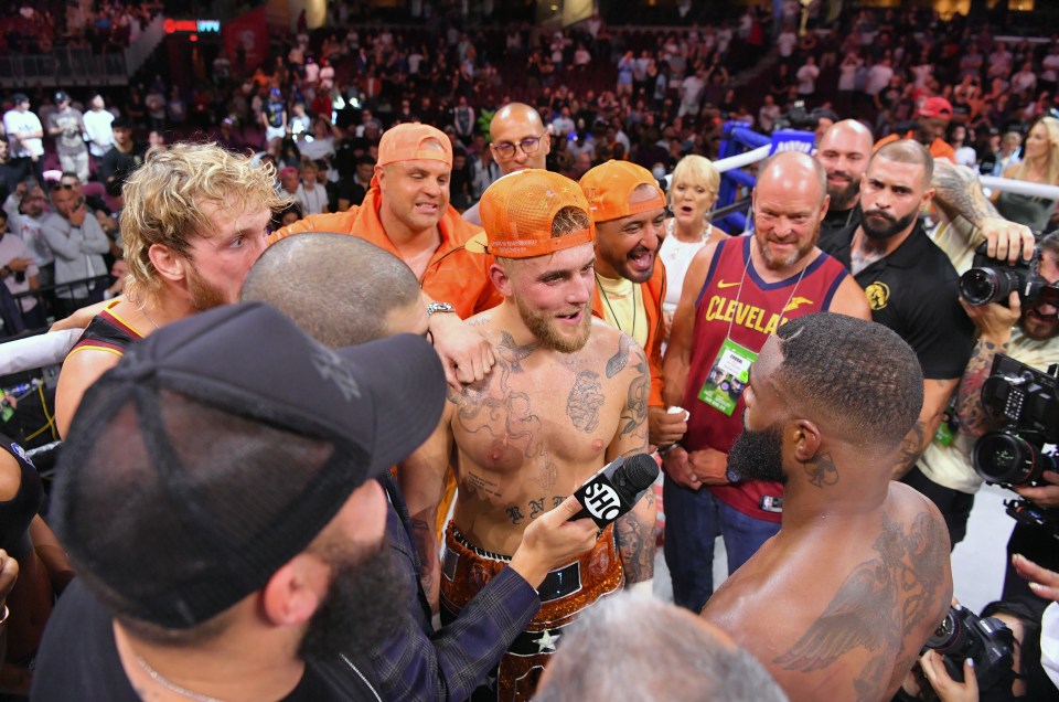 Jake Paul and Tyron Woodley confront each other after the fight