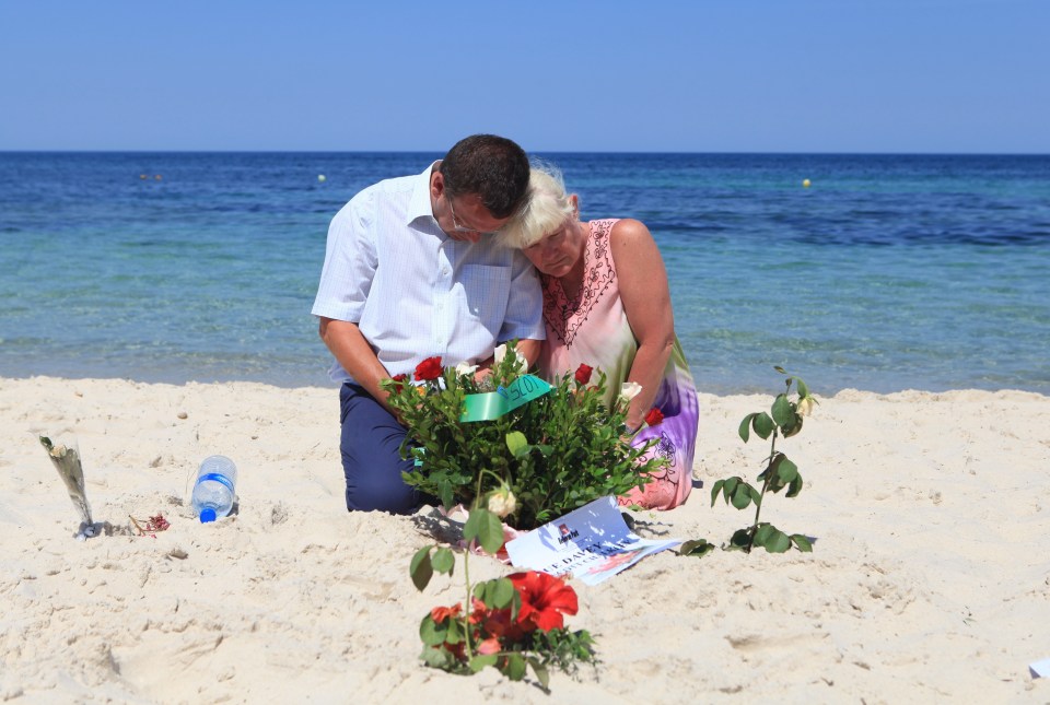 Flowers are laid on a Tunisian beach where an Islamic gunman killed 38 in 2015