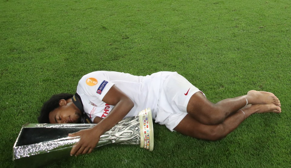 Kounde celebrates winning the Europa League trophy