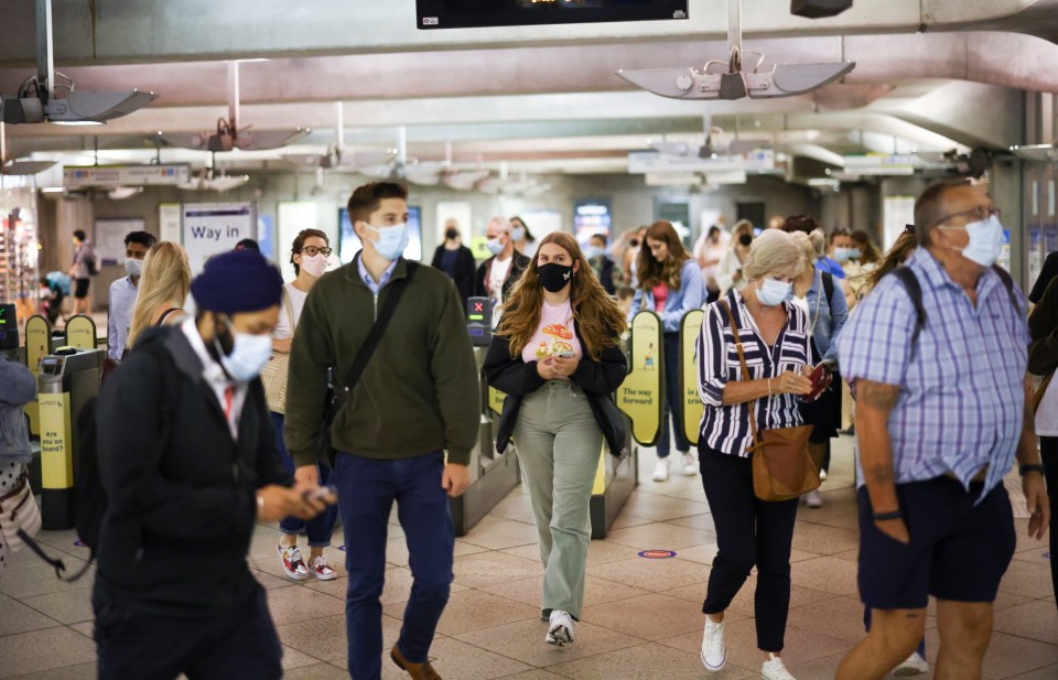 Double-jabbed Brits will be asked to carry on wearing masks if they're pinged