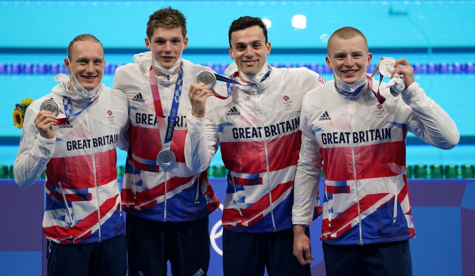 Team GB celebrate with their silver medals after the 4x100 medley relay