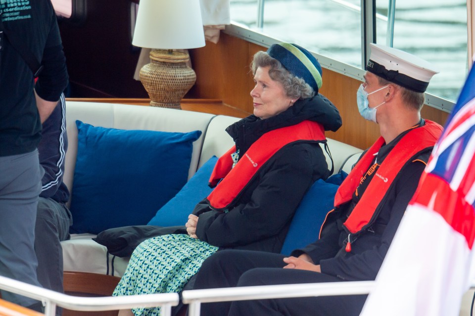 Imelda sat alongside a sailor who wore a face mask