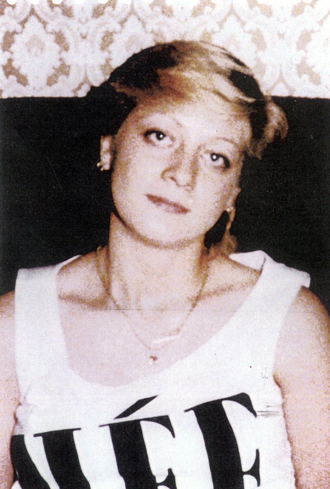 a woman wearing a white tank top with the word life on it