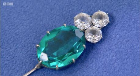 The real value of a glistening green brooch - as well as its genuine gem - came to light on the BBC programme