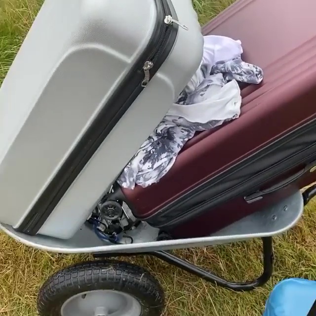 Gemma trekked through the fields with a wheelbarrow of luggage