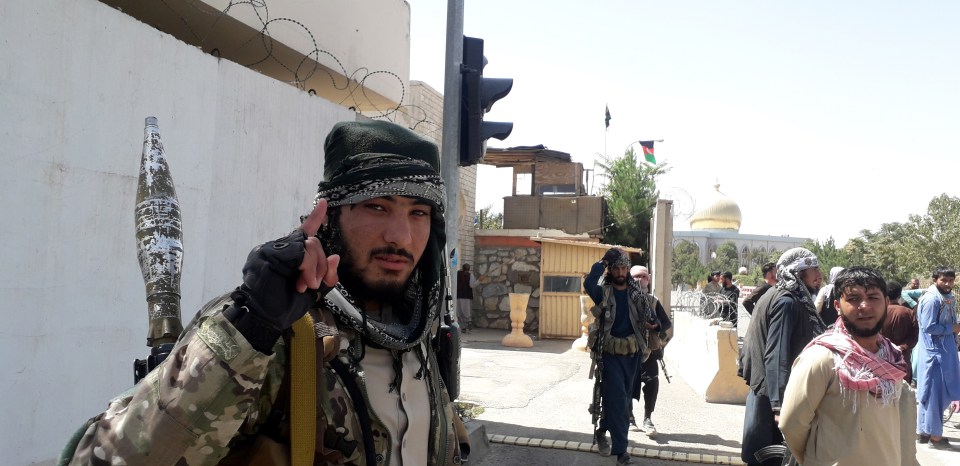 A Taliban fighter celebrating after the defeat of government forces