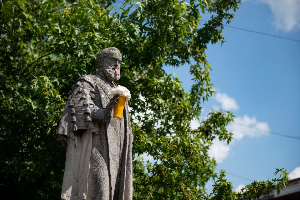 The elusive artist showed off his comical side by adding a tongue to this statue and handing him an ice cream