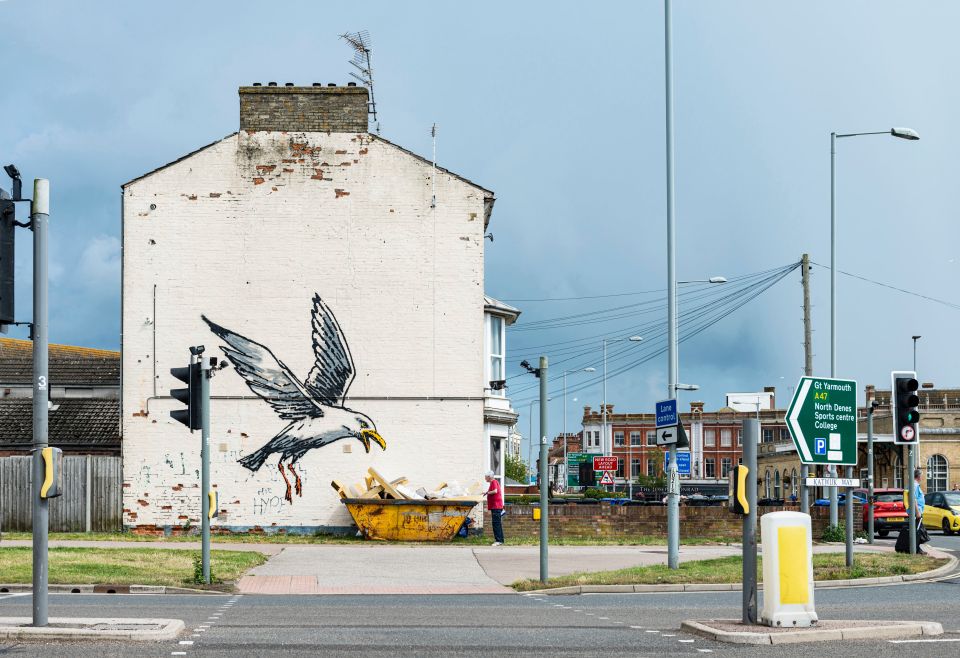 A seagull appearing to chow down on some 'chips' from a skip in Lowestoft