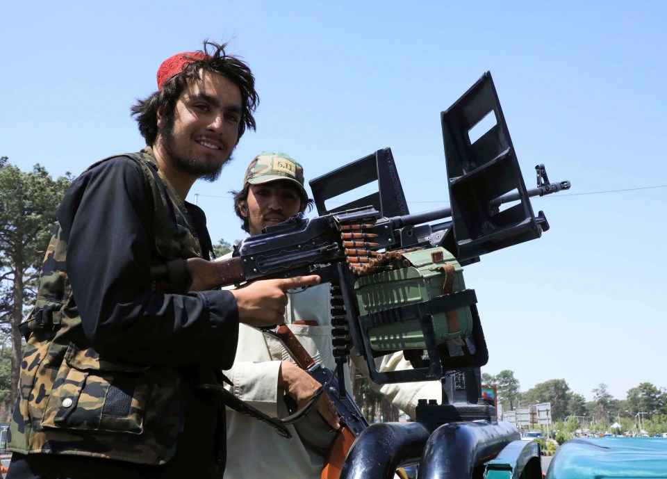 Taliban forces patrol a street in Herat, Afghanistan August 14, 2021