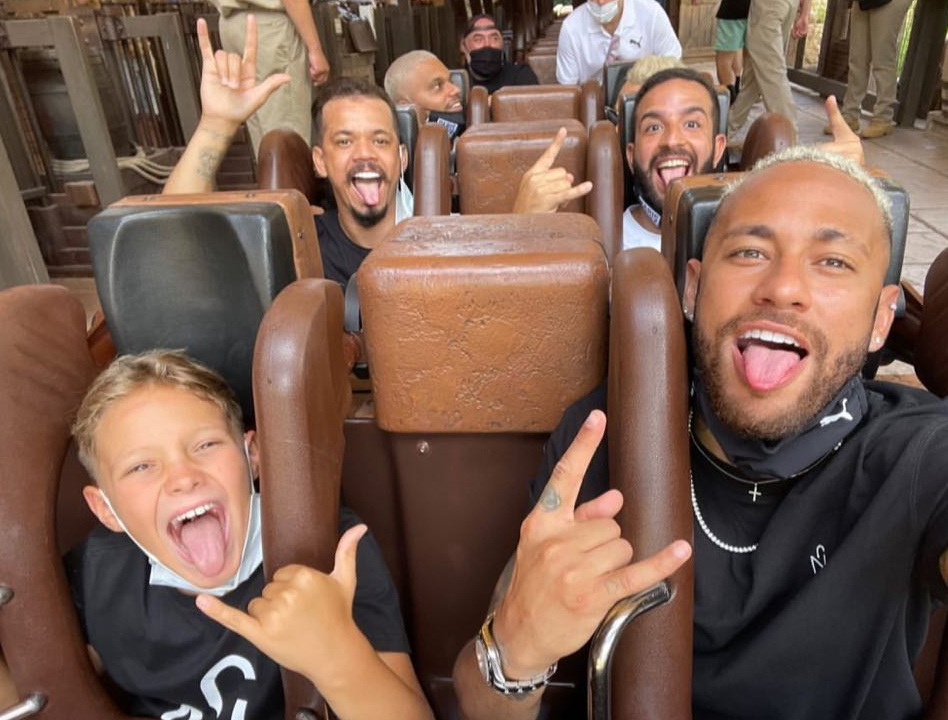 The Brazilian and his nine-year-old Davi Lucca enjoy a rollercoaster ride