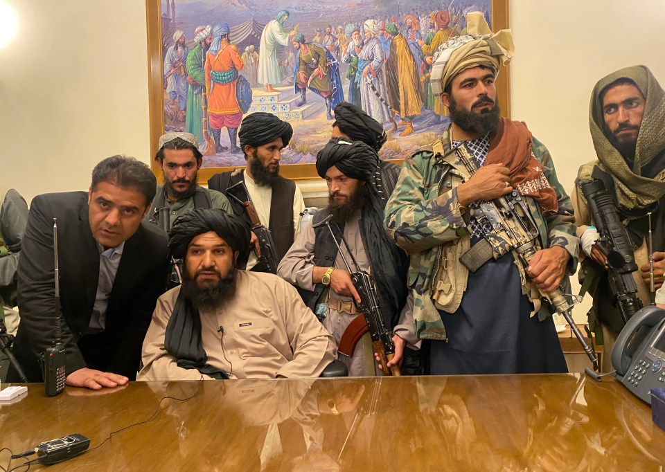 Taliban fighters take control of the presidential palace after the Afghan President Ashraf Ghani fled the country