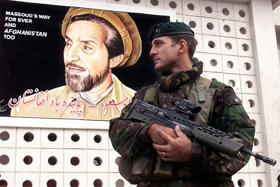 A British soldier standing guard during the installation ceremony of new Afghan interim government in December 2002 that would keep terror at bay