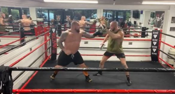 Eddie Hall is training just three weeks after having bicep reattachment surgery