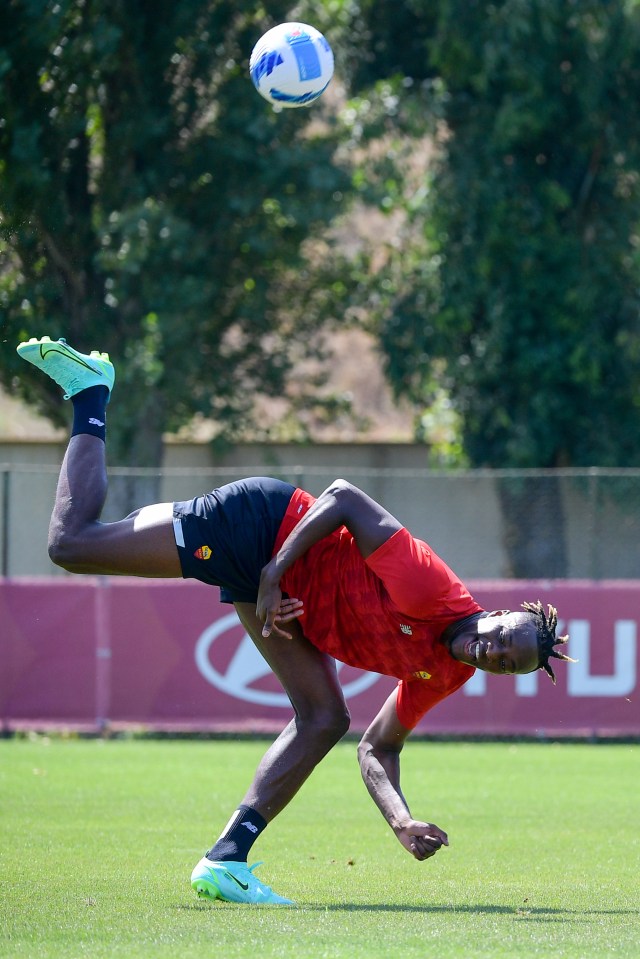 He was pictured laughing as he took to the training field