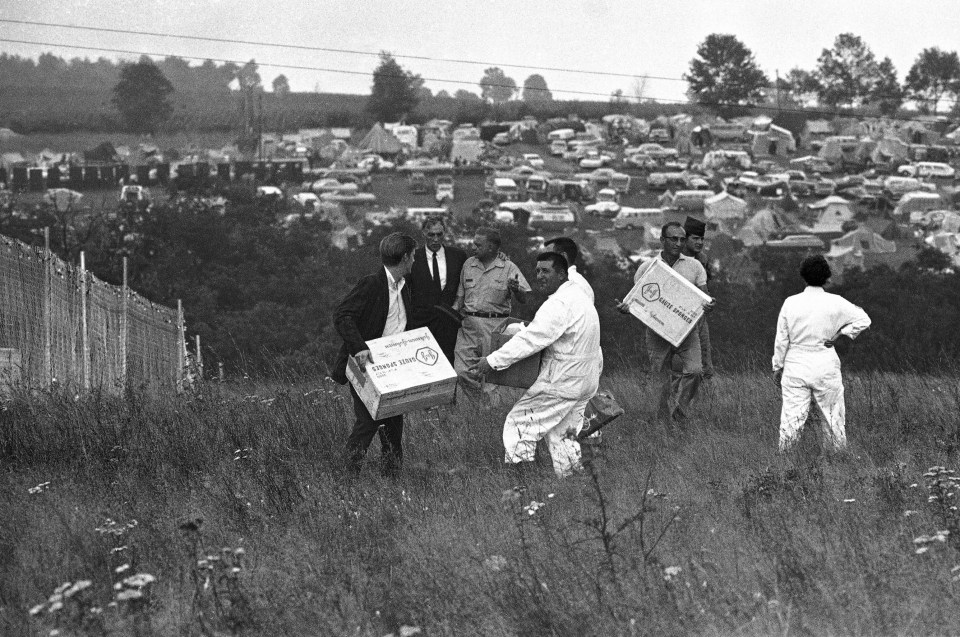 Medics carrying supplies rush to the festival where more than 3,000 people required treatment