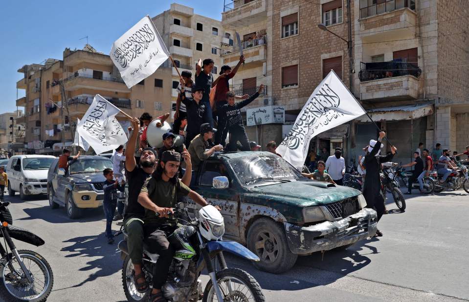 Triumphant supporters of the Taliban parade through Kabul