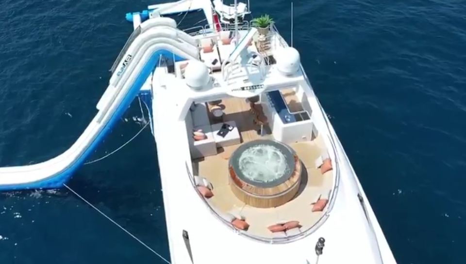 The enormous super yacht features plenty of amenities like a giant inflatable slide