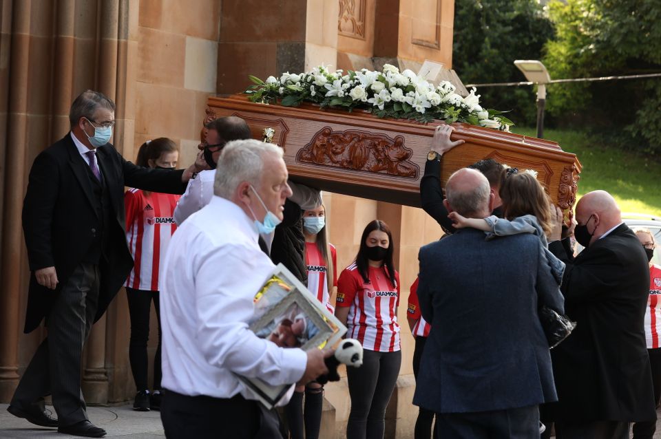 Mourners carried her coffin into the church