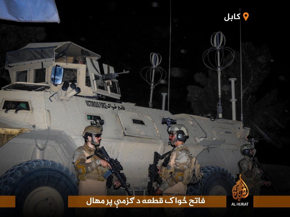 Taliban troops have painted the term 'Victorious Force' on the side of an M1117