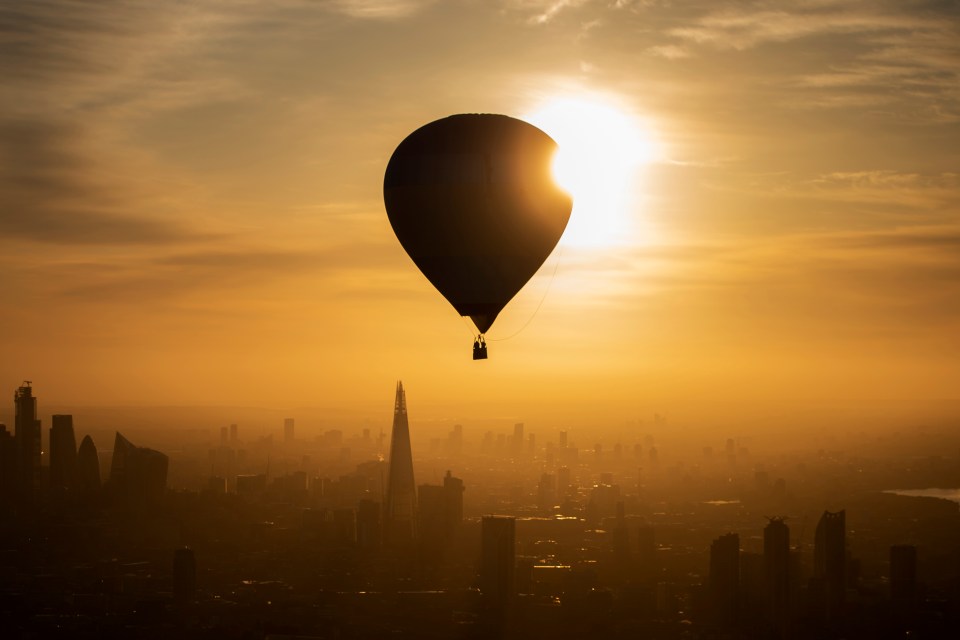 A hot air balloon flies over London during the 2019 RICOH Lord Mayor's Hot Air Balloon Regatta