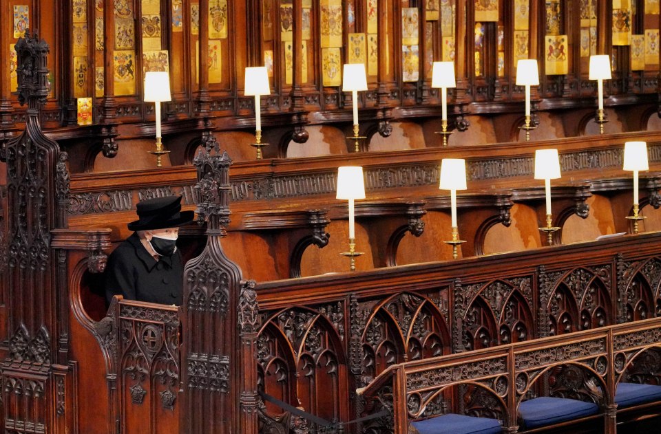 Queen Elizabeth II takes her seat for the funeral of the Duke of Edinburgh, who died at the age of 99, during his funeral service in St George's Chapel, Windsor Castle, Berkshire