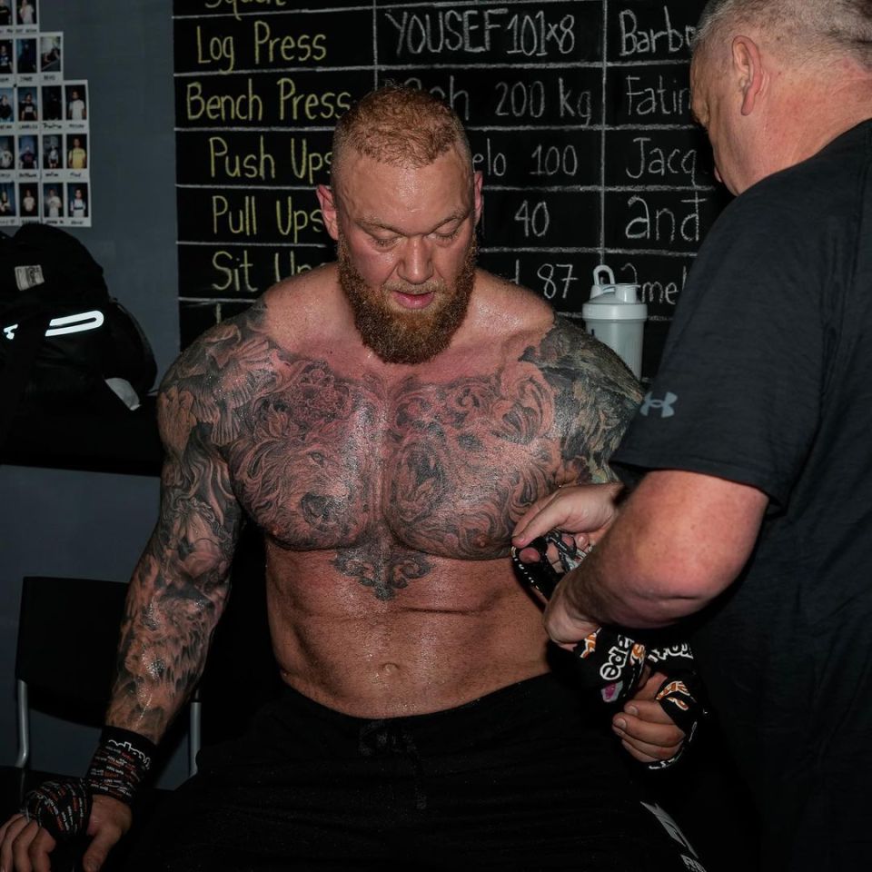 Bjornsson's gruelling workout routine can be seen in the background