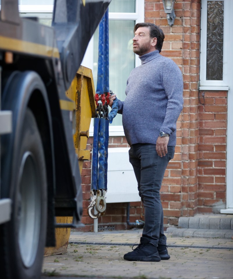 And he even got hands on as he helped chain up a skip on the back of a lorry