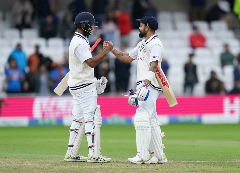 Cheteshwar Pujara embraces India skipper Virat Kohli