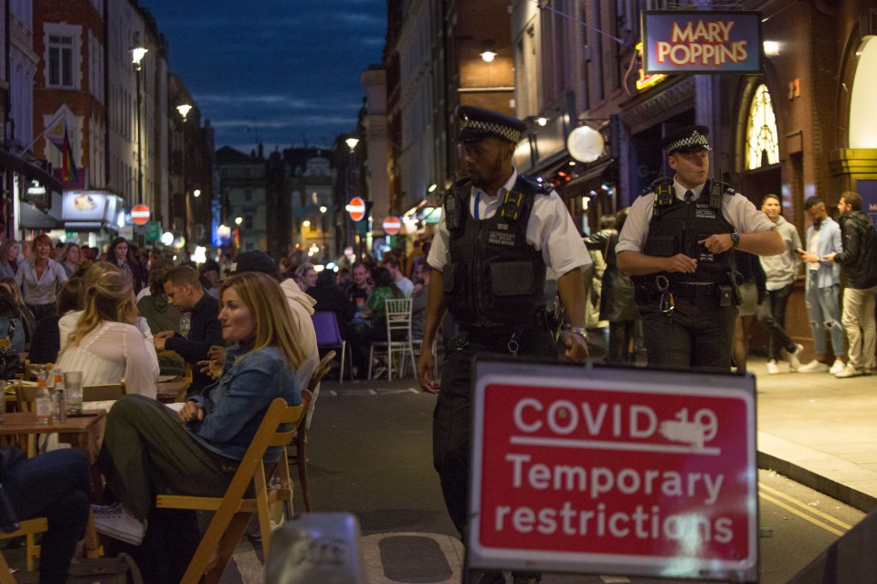 Cops in London patrolled the packed streets of Soho