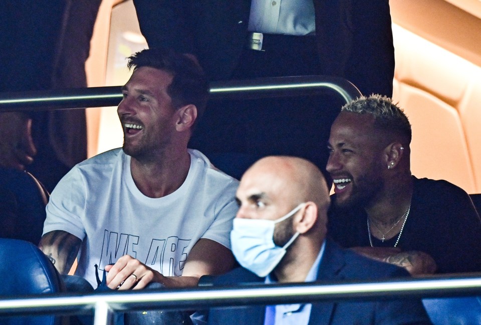 Lionel Messi watches the game alongside old pal Neymar